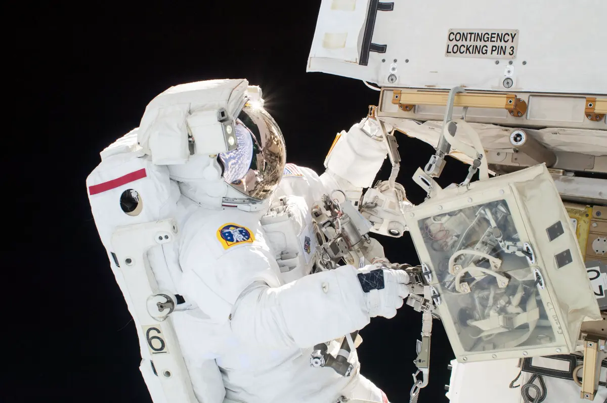 An astronaut on a spacewalk outside the International Space Station